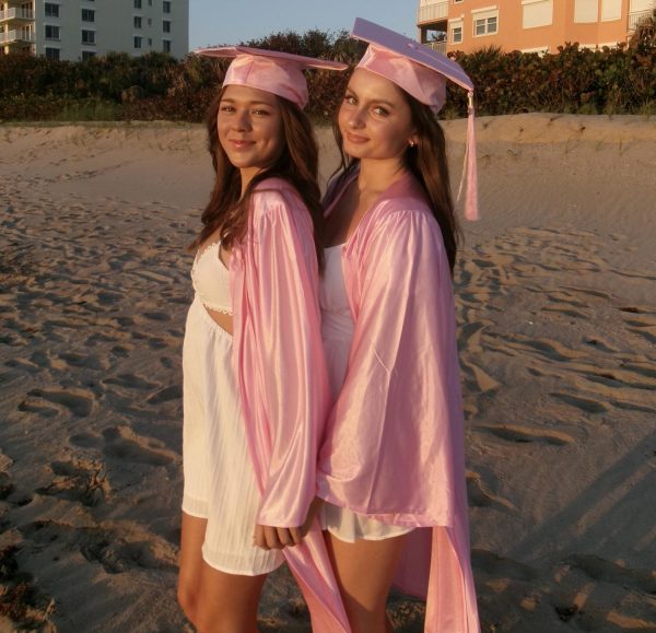 Seniors Emily Eason (left) and Chloe Marrs pose on the beach as their graduation date approaches.