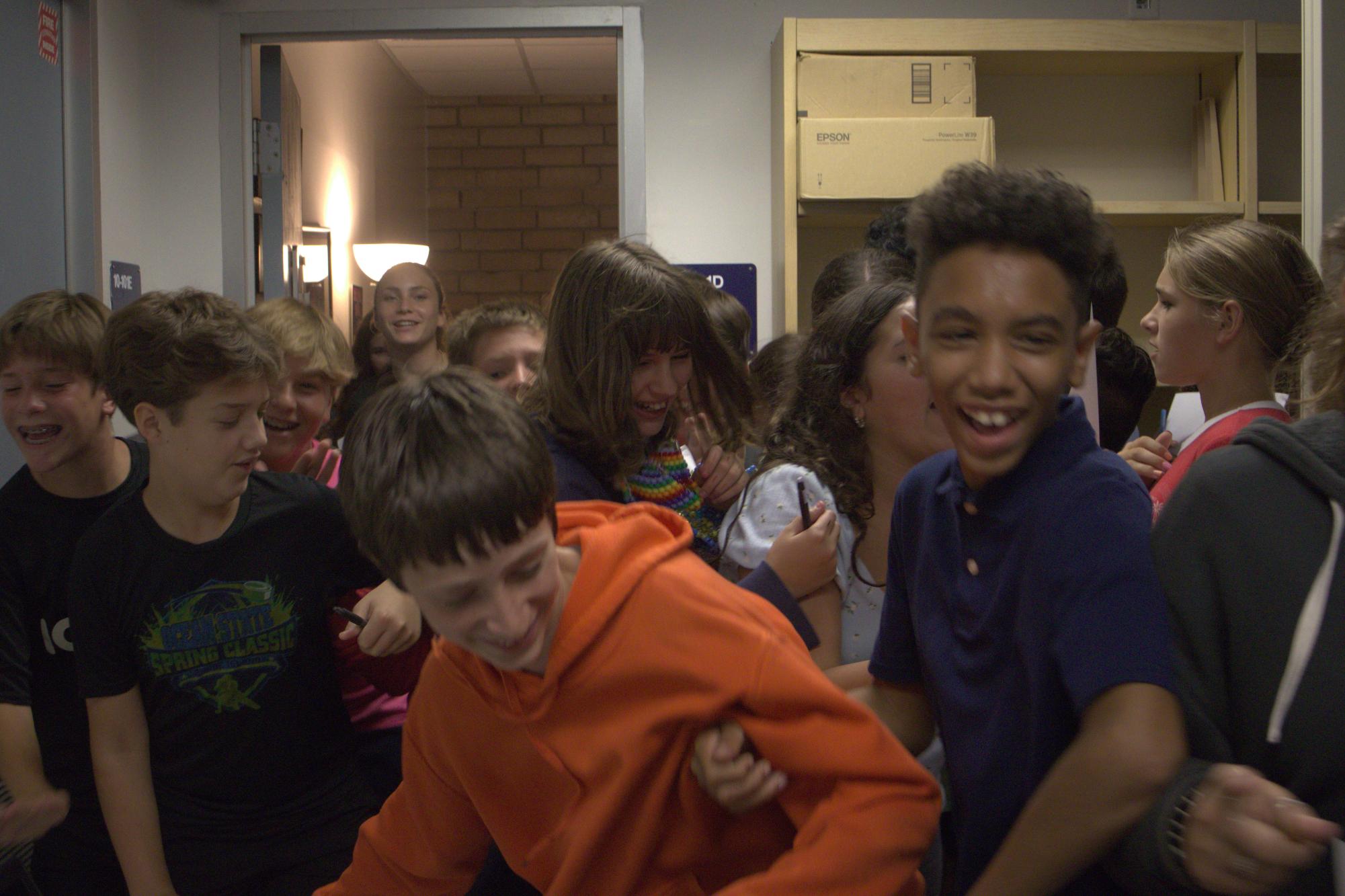 Seventh graders crowd the entrance of School Resource Officer Valerie Butler's office as they try to get her signature on Aug. 15. "My favorite stop on the scavenger hunt was probably Officer Butler’s office because it was chaos getting through there," seventh grader Chase Saunders said. "We were looking for her for like 10 minutes.