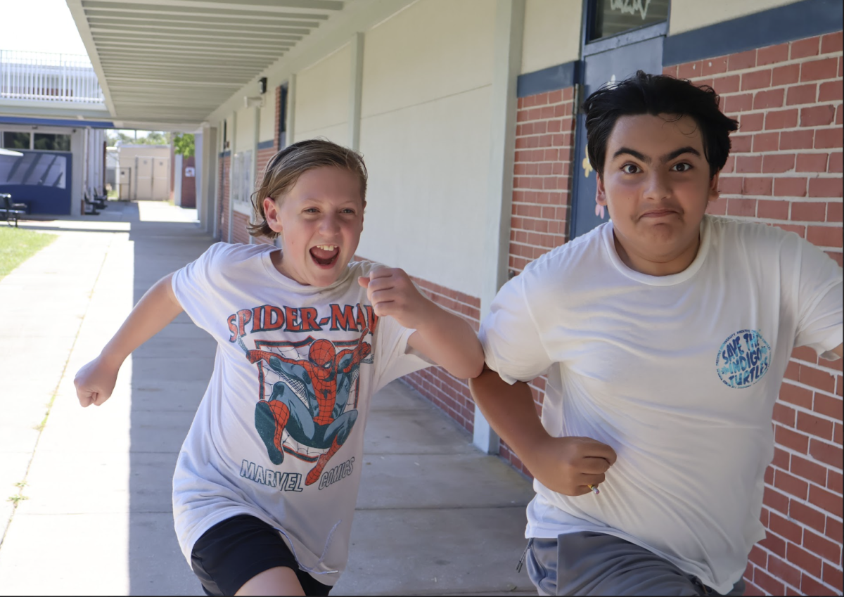 Seventh graders run to their next scavenger hunt spot during "Wildcats on the Prowl" on Aug. 15.