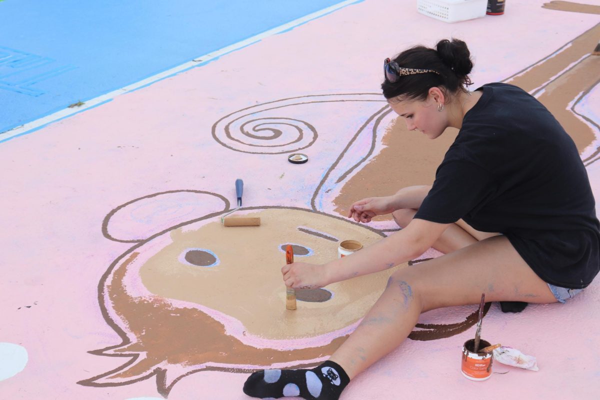 Senior Willow King paints her parking spot on Sept. 7.