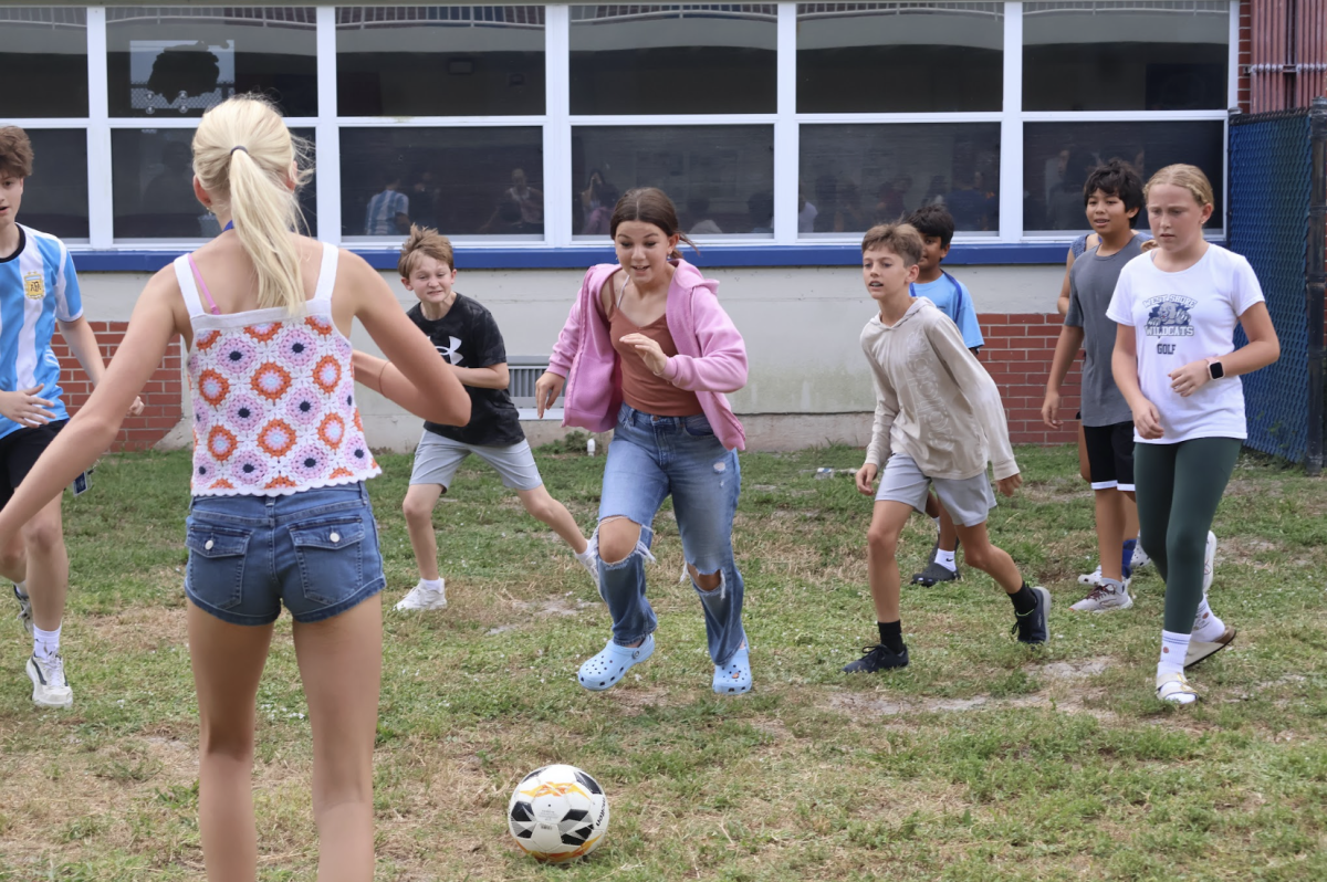 Students play soccer between Buildings 2 and 3 during lunch. 