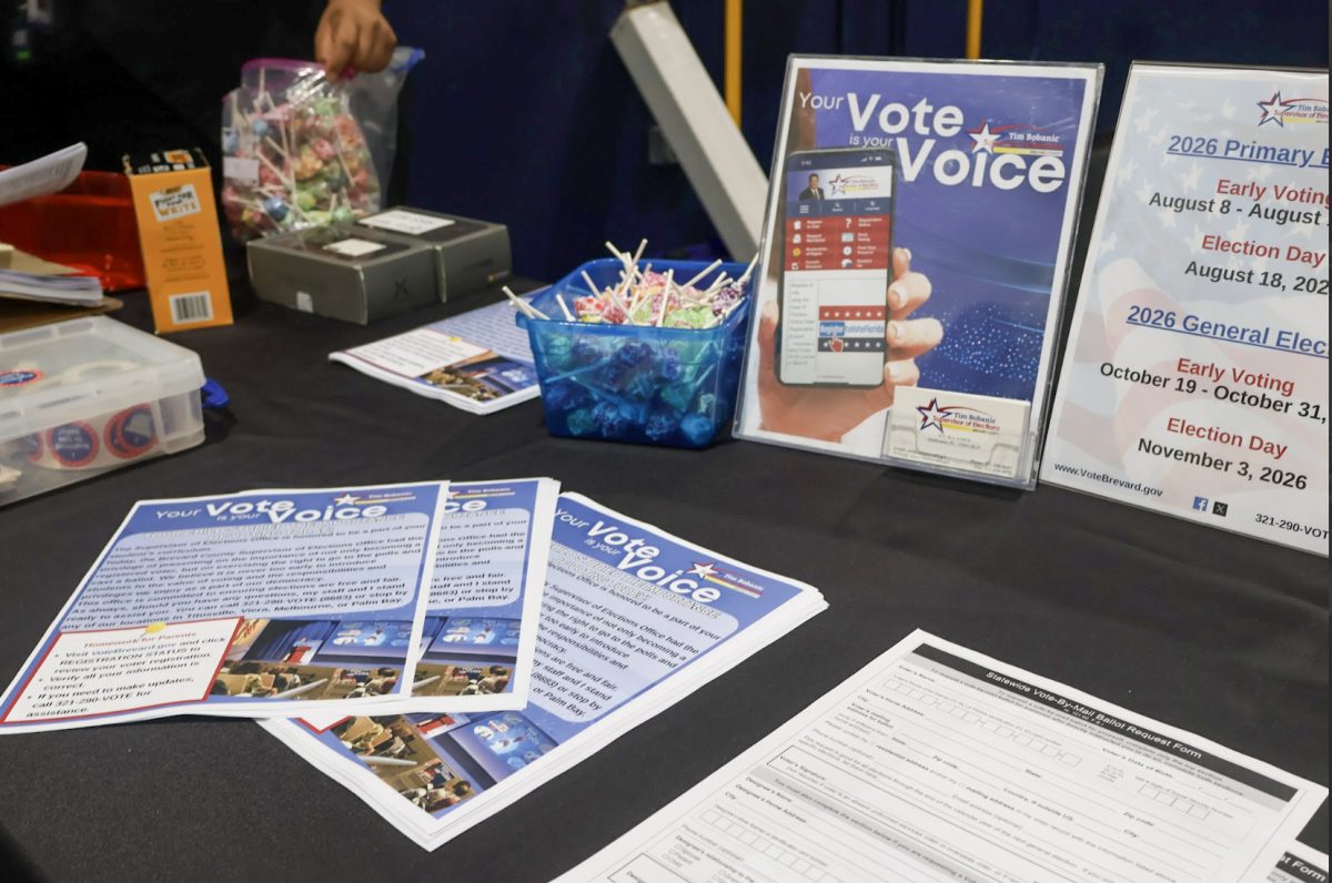 A table with voting and registration materials was set up in the gym while Tim Bobanic, the Brevard County supervisor of elections, gave a presentation to juniors and seniors on Sept. 25.