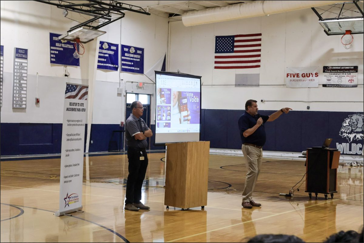 Tim Bobanic (right), the Brevard County supervisor of elections, delivers a presentation to juniors and seniors on the importance of voting on Sept. 25.