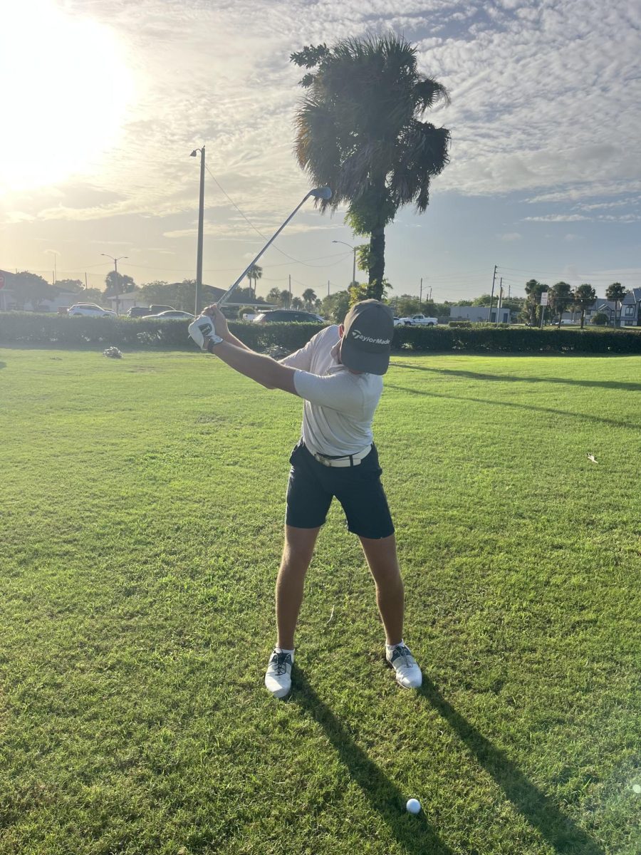 Senior Daniel Boyd prepares to swing during a match.