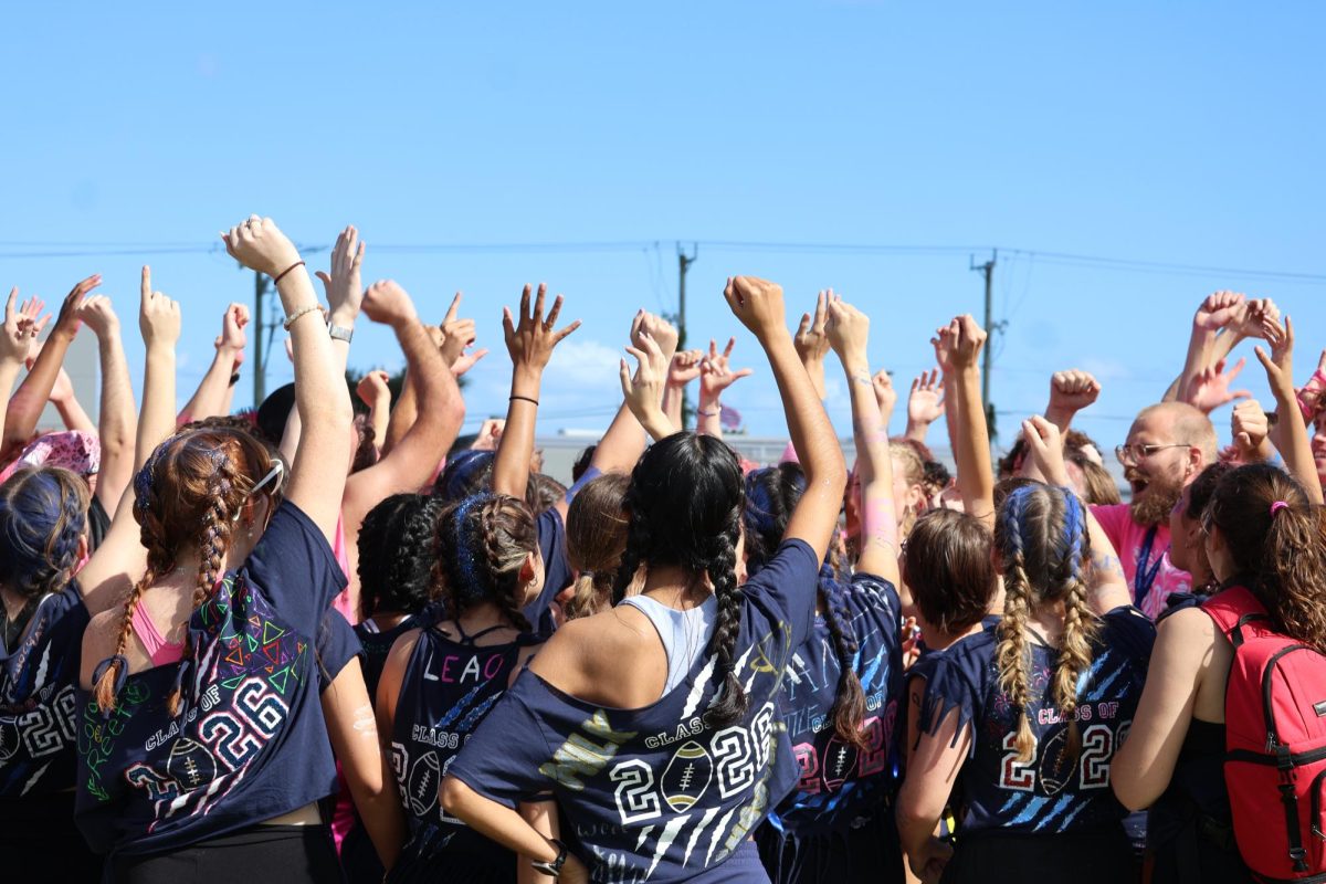 The senior class cheers after winning powder-puff on Oct. 17. “The energy that all the seniors had was awesome and we couldn’t have won without it," senior Gabby Marold said. "It was super exciting to win our last powderpuff and celebrate with everyone.”