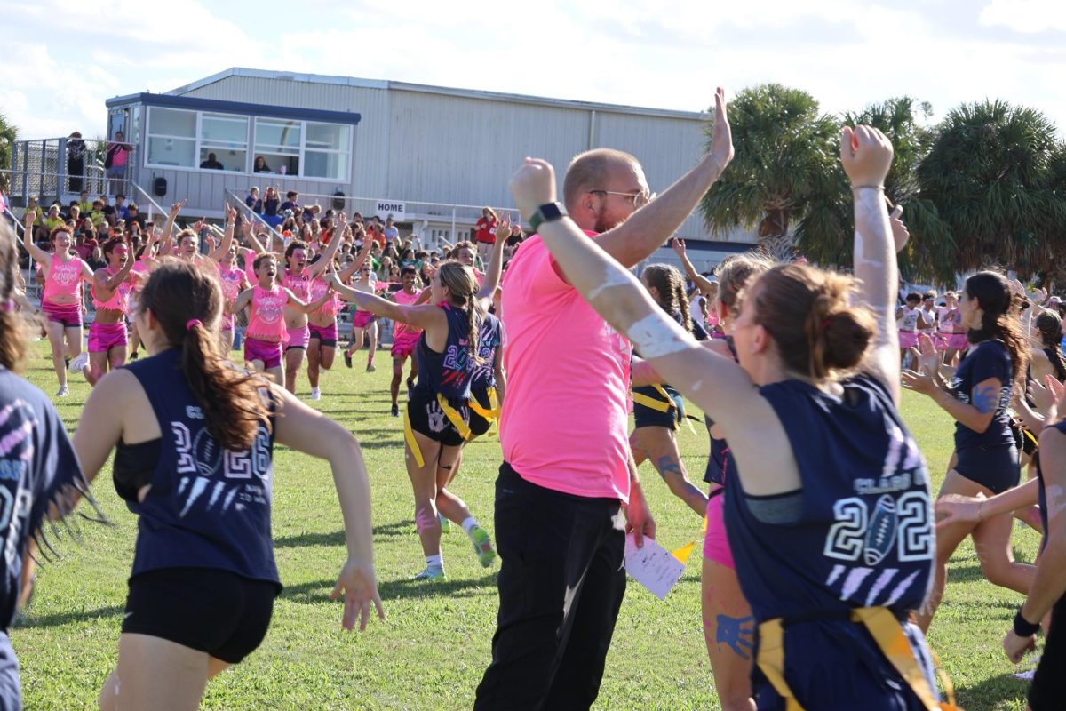 The senior class storms the field after winning powder-puff on Oct. 17. “I’m so happy we won, this year's game was a lot more enjoyable," senior Emily Marshall said. "I feel like we had better sportsmanship among us. I made some mistakes early on so afterwards I was just trying to remain as locked as possible so I wouldn't hinder my team.”