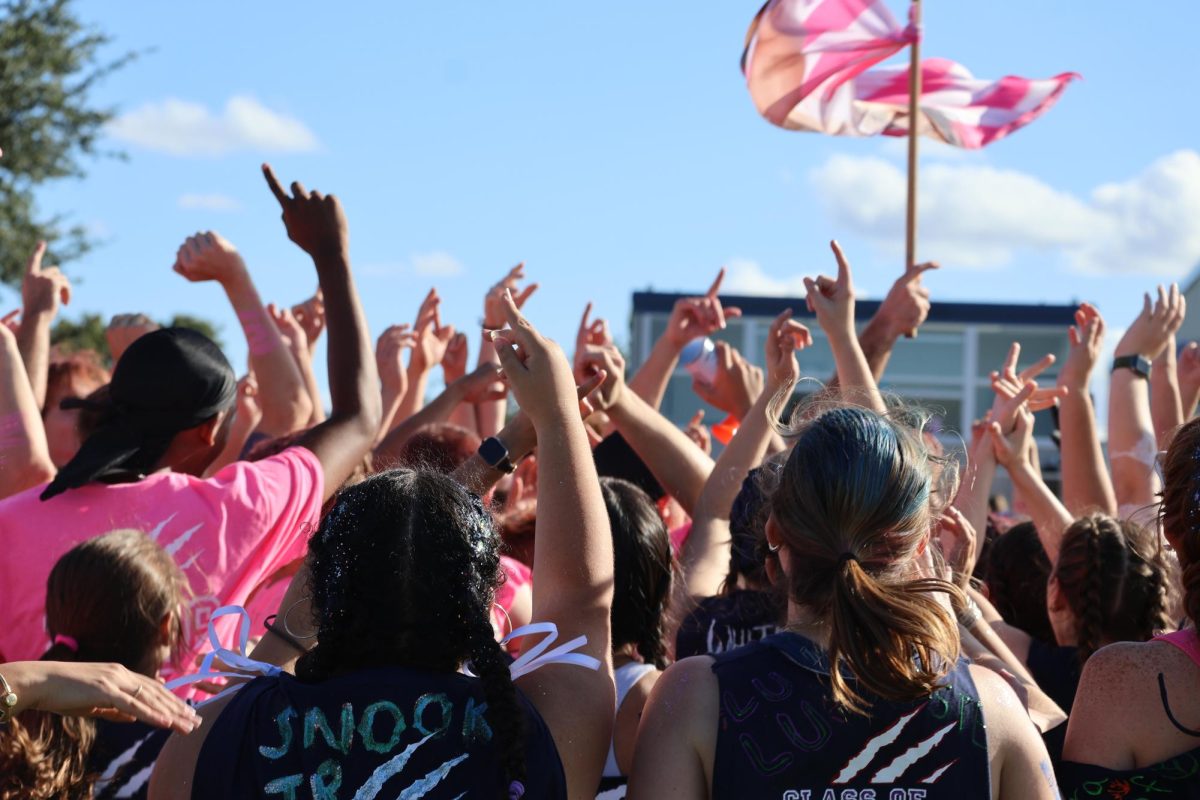 The senior class celebrates after winning powder-puff on Oct. 17.