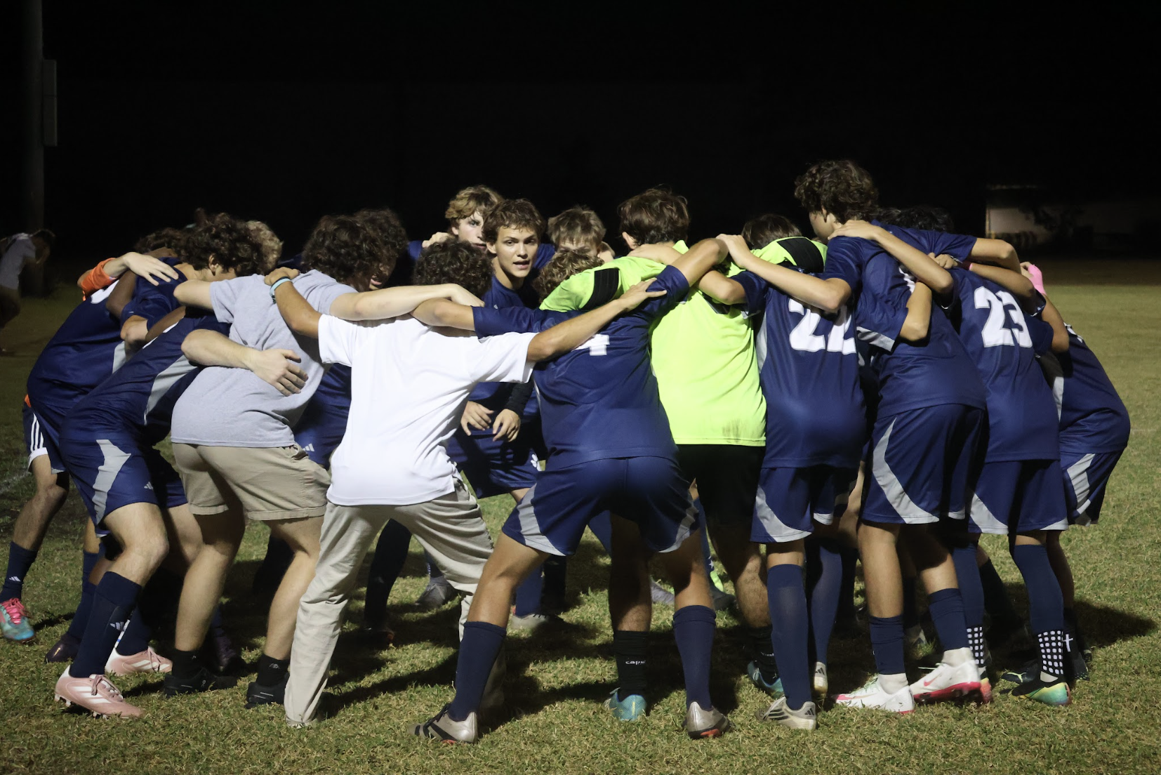 Preparing to take on MCC, the boys varsity soccer team listens to senior and captain Luke Markos' pep talk on Nov. 7. The team defeated MCC 3-1.