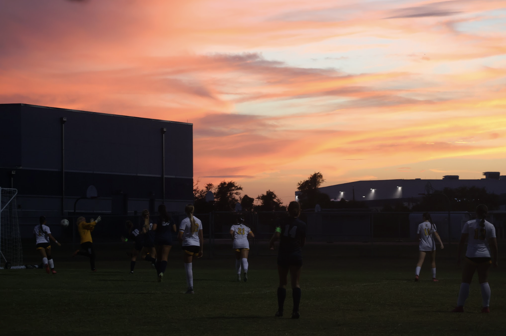 As the sky grows dark, the girls varsity soccer team takes on MCC on Nov. 7.