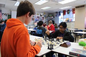 During the weekly Chess Club meeting, seventh grader Kavin Jayasuriya (right) makes his next move against seventh grader Brendan Donigan on Jan. 30.