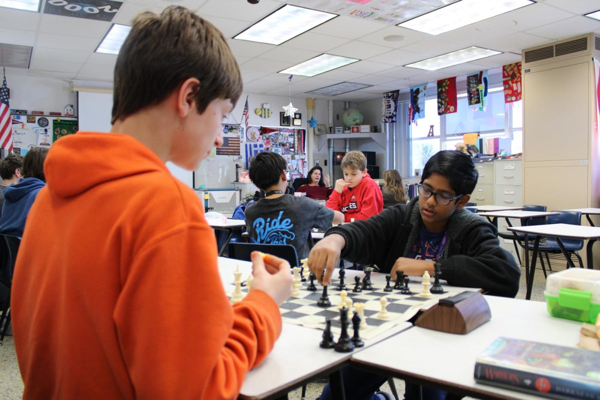 During the weekly Chess Club meeting, seventh grader Kavin Jayasuriya (right) makes his next move against seventh seventh grader Brendan Donigan on Jan. 30.