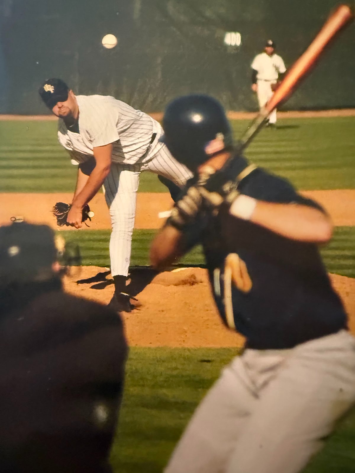 Principal Burt Clark (left) pitches against Charleston Southern as a junior at UCF in 2003.