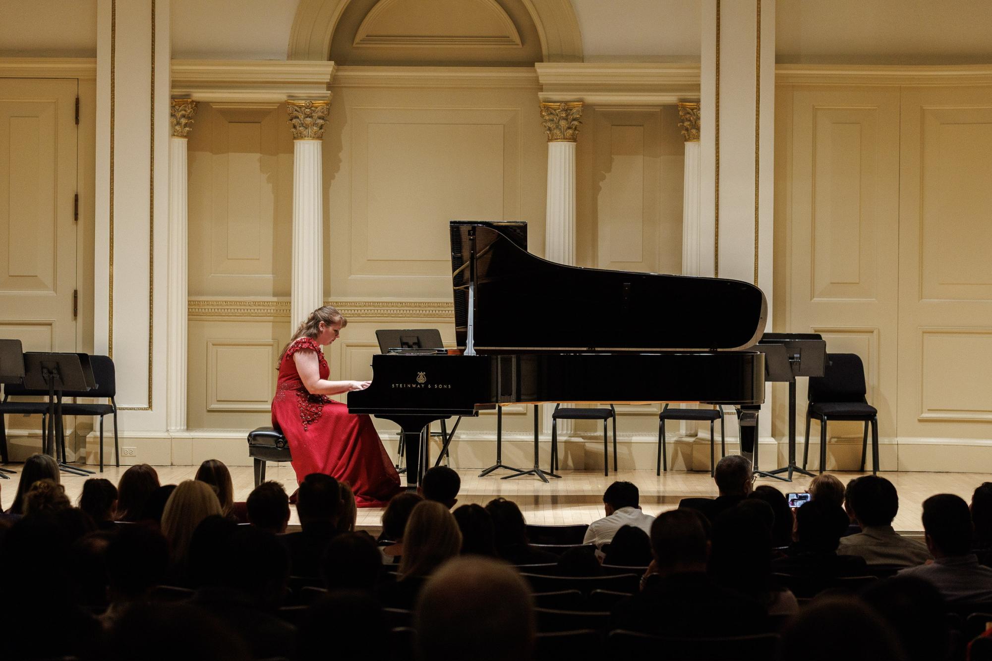 Sitting on the piano bench for her fifth performance, Melanie Richardson performs at Carnegie Hall in New York on Nov. 9, 2025.