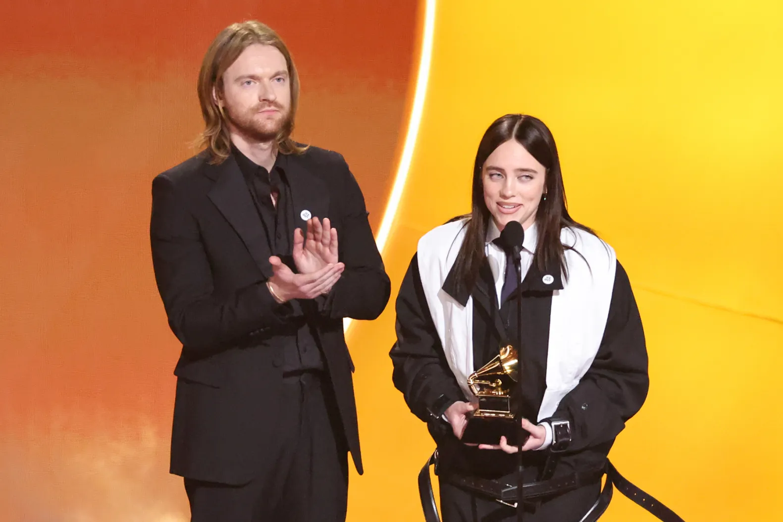 Winning for her song “Wildflower,” Billie Eilish (right) alongside her brother and
co-songwriter Finneas accept their award for Song of the Year at the 68th annual Grammy Awards.