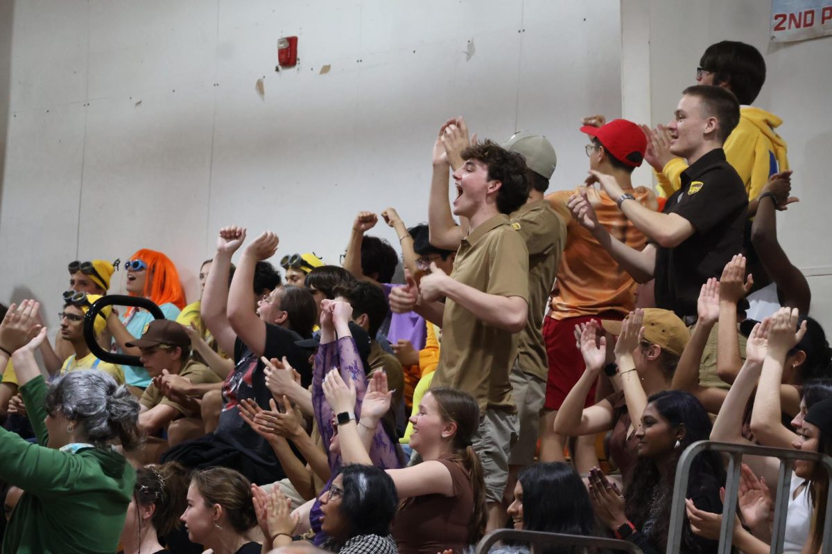 Watching the seniors take on the juniors in volleyball, seniors cheered on their classmates during Wildcat Challenge on March 6. The seniors won the volleyball competition and Wildcat Challenge.