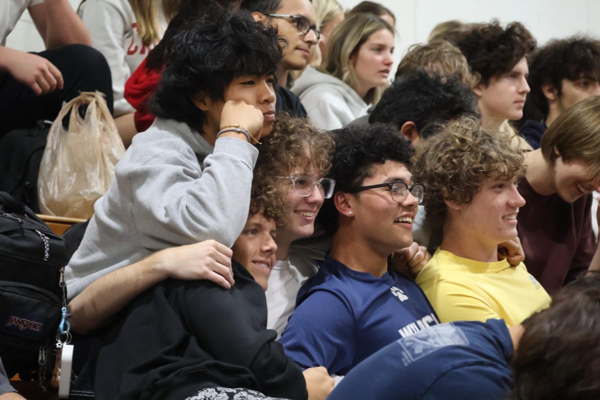 Hugging in the stands, juniors Dino Villanueva (left), McOwen Maxwell, Zayden Manore, Logan Walsh and Treven Lynes come together for the speeches in the gym on Wednesday, April 22. 