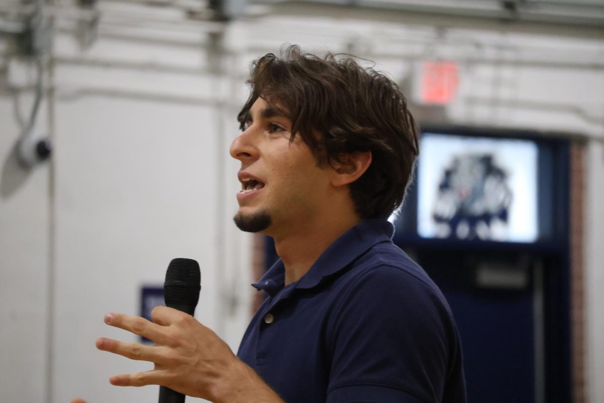 Addressing the junior class in the gym on Wednesday, April 22, senior class presidential candidate Ben Resnick gives his speech. 