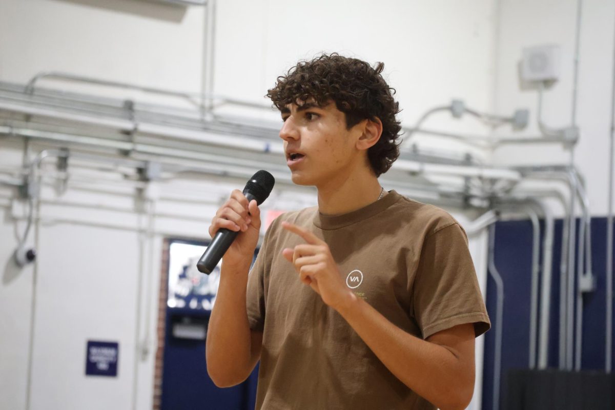 Giving the junior class a rundown of the past year's accomplishments, senior class president candidate Matthew Grainger gives his campaign speech in the gym on Wednesday, April 22. 